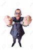 21516170-Funny-businessman-with-handcuffs-on-white-Stock-Photo.jpg